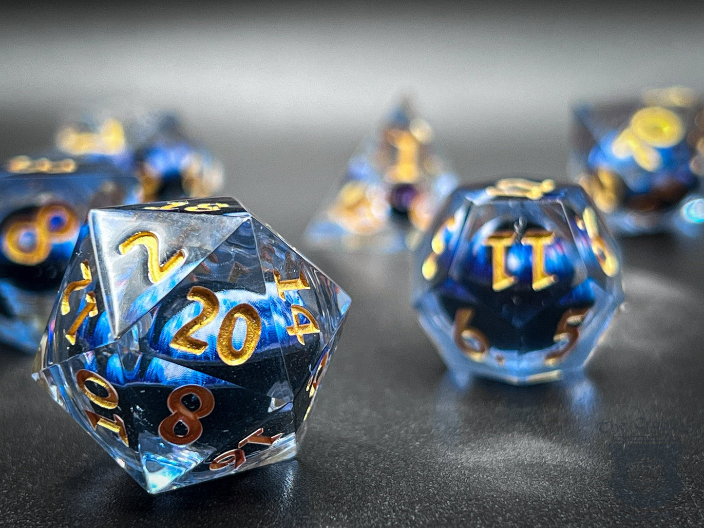 The Crooked Tavern Handmade Dice Sets Floating Eye Liquid Core RPG Dice Set | Blue/Gold