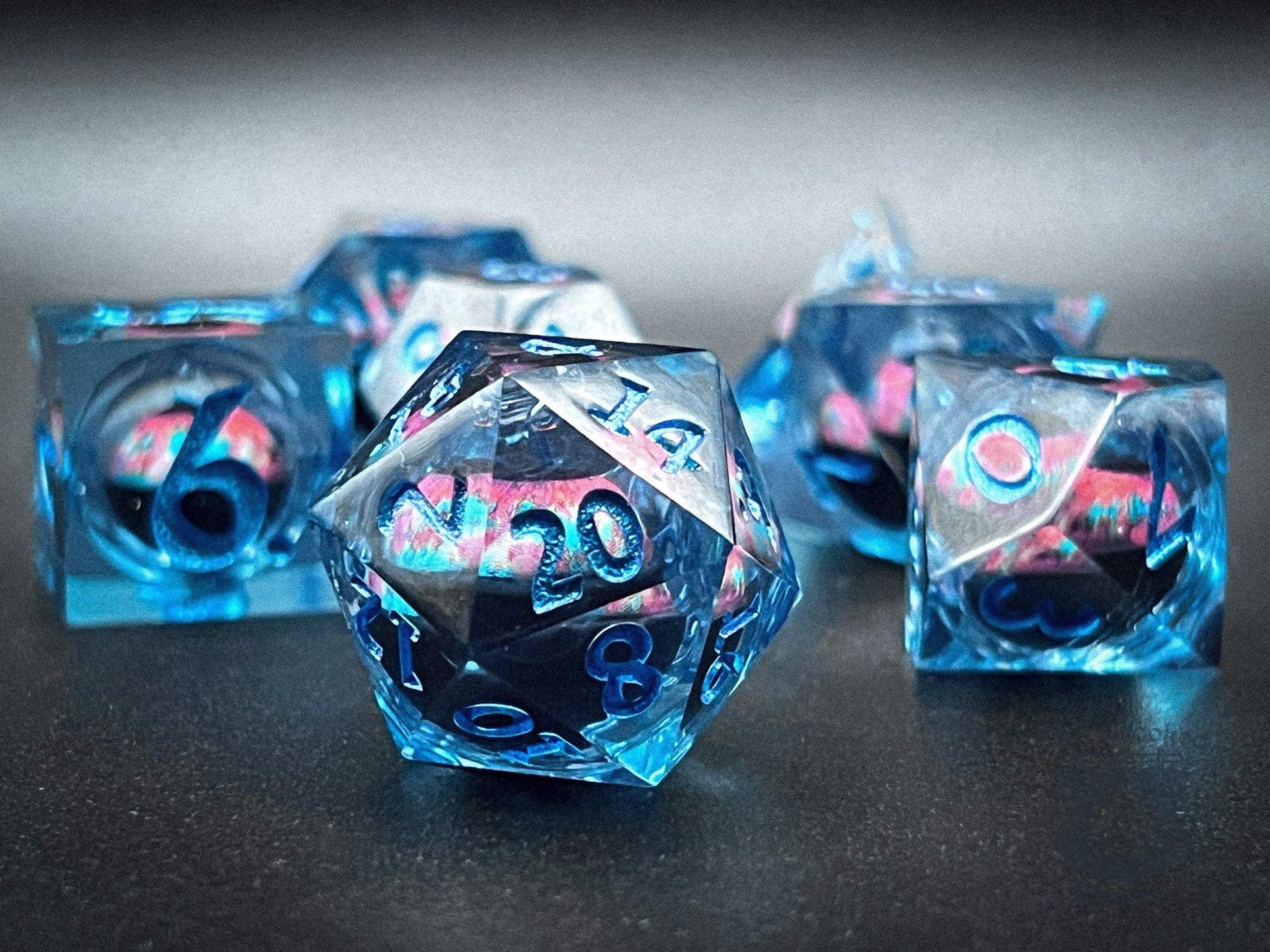 https://crookedtavern.com/cdn/shop/files/the-crooked-tavern-handmade-dice-sets-floating-eyeball-liquid-core-rpg-dice-set-blue-pink-eye-37998359969961.jpg?v=1701358287&width=1946