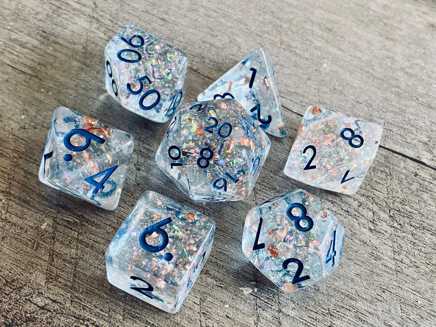 The Crooked Tavern Dice Sets Frozen Treasure RPG Dice Set | Clear Resin with Faux Rose Gold Flakes Inside!