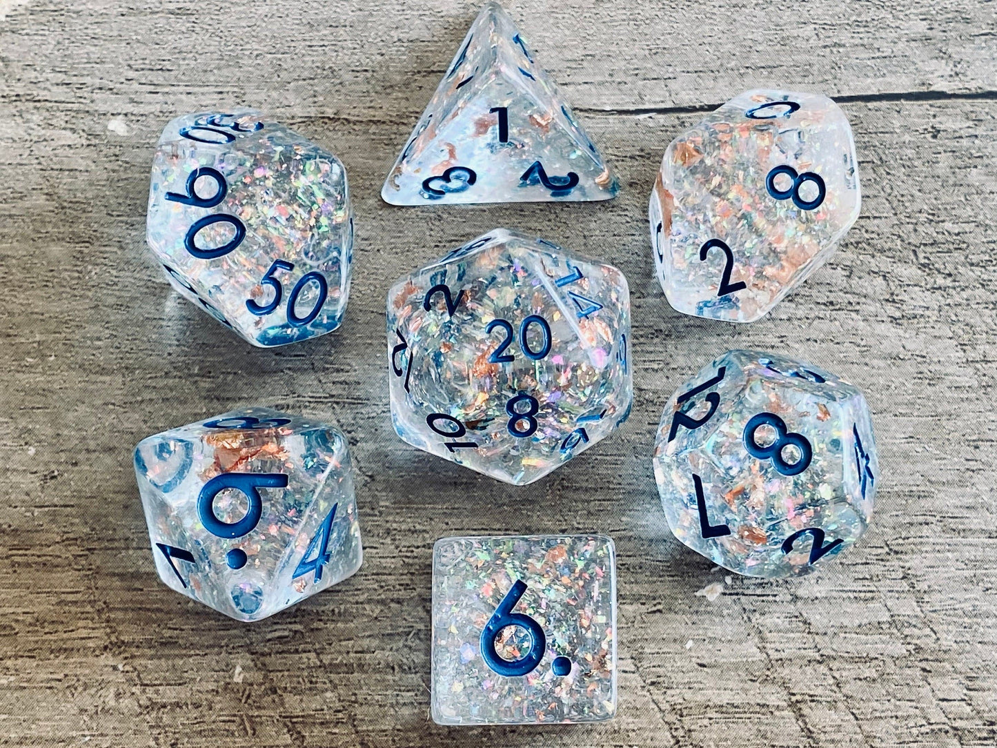 The Crooked Tavern Dice Sets Frozen Treasure RPG Dice Set | Clear Resin with Faux Rose Gold Flakes Inside!