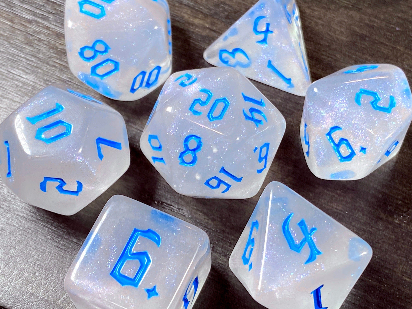 The Crooked Tavern Dice Sets Icewind RPG Dice Set | White Sparkles with Blue Font!