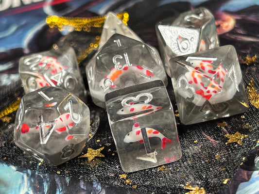 The Crooked Tavern Dice Sets Midnight Koi Fish RPG Dice Set | Red Koi Fish with Swirling Dark Resin