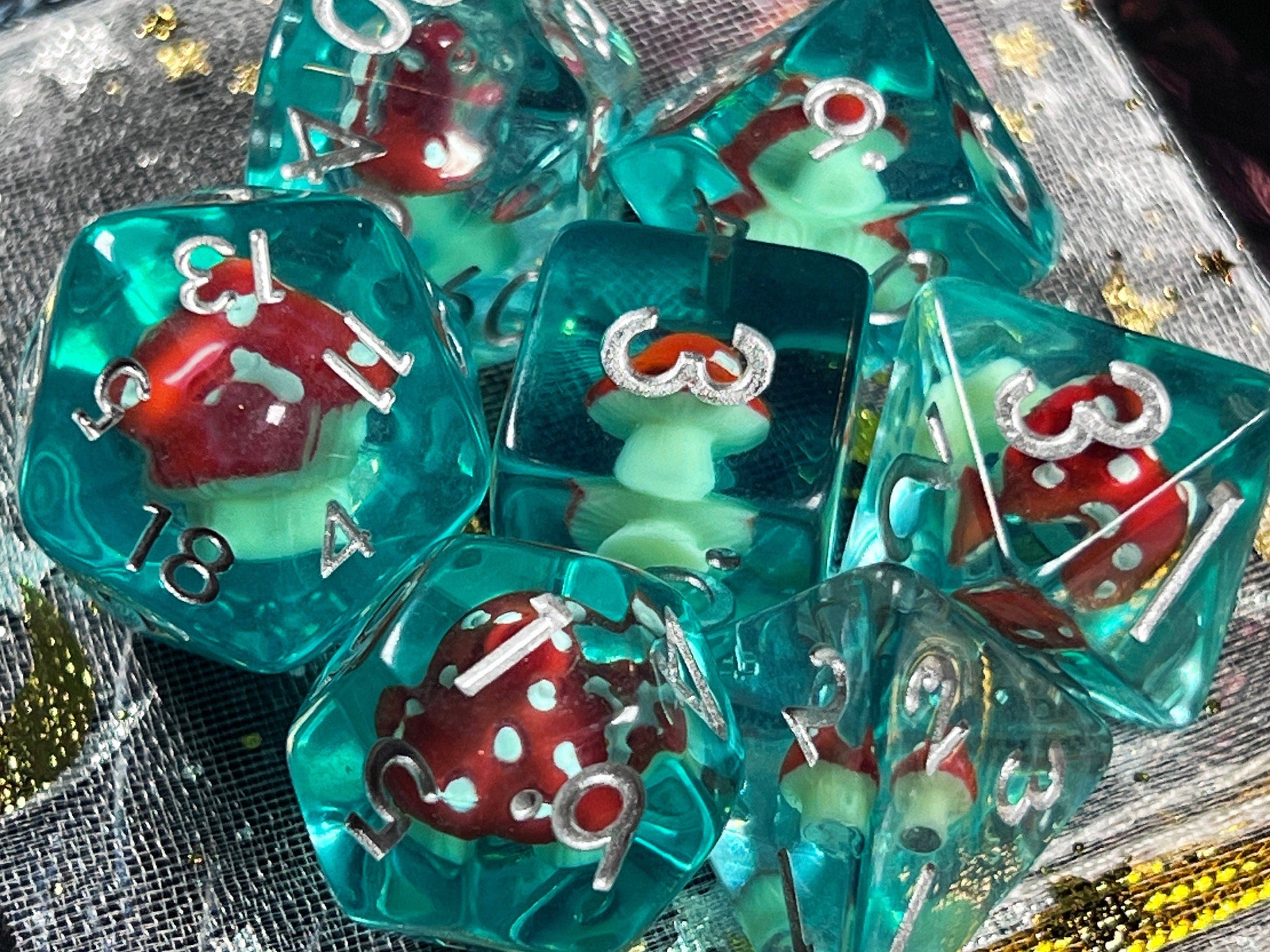 The Crooked Tavern Dice Sets Toadstool RPG Dice Set | Blue Resin with a toadstool inside!