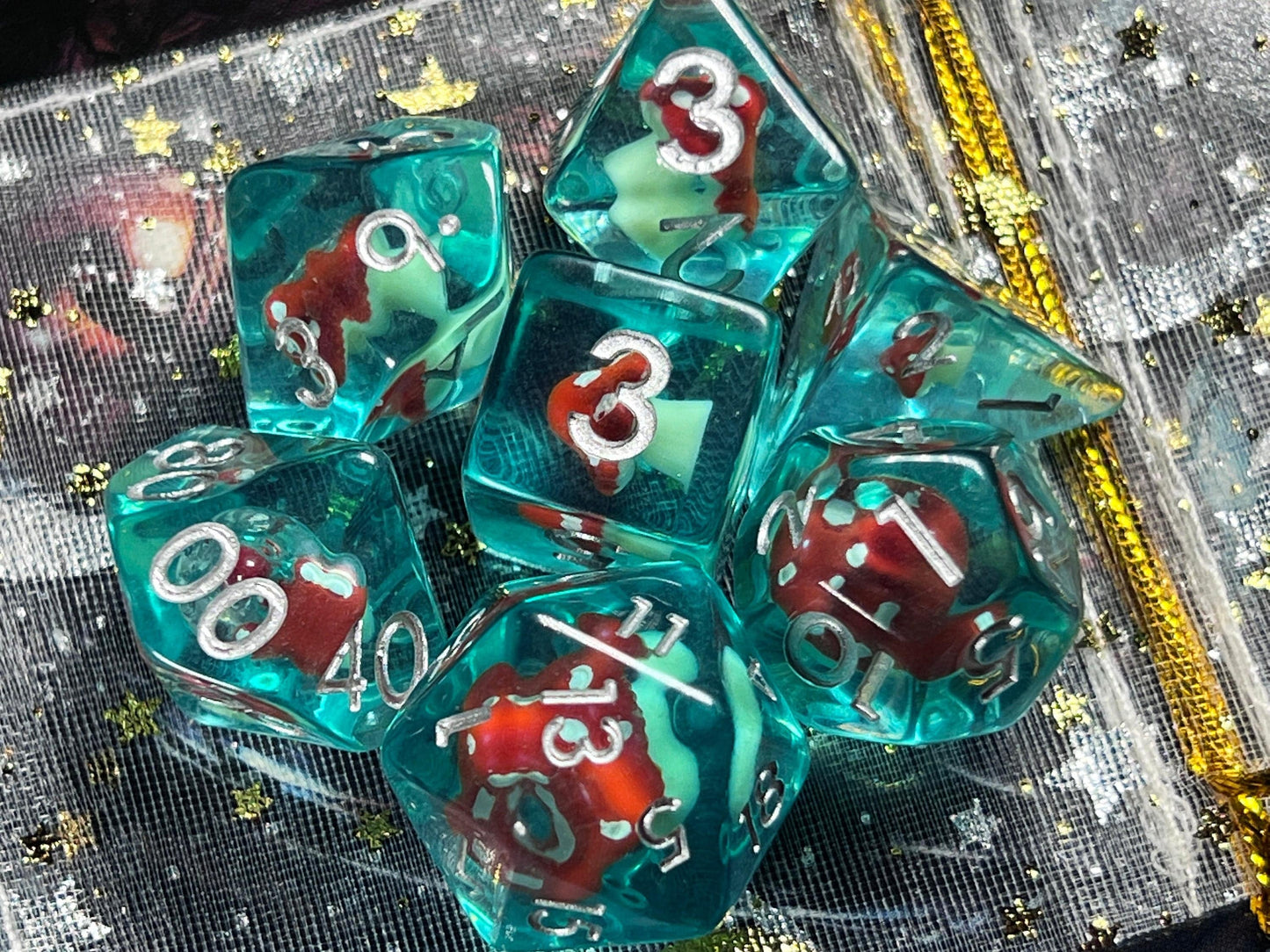 The Crooked Tavern Dice Sets Toadstool RPG Dice Set | Blue Resin with a toadstool inside!