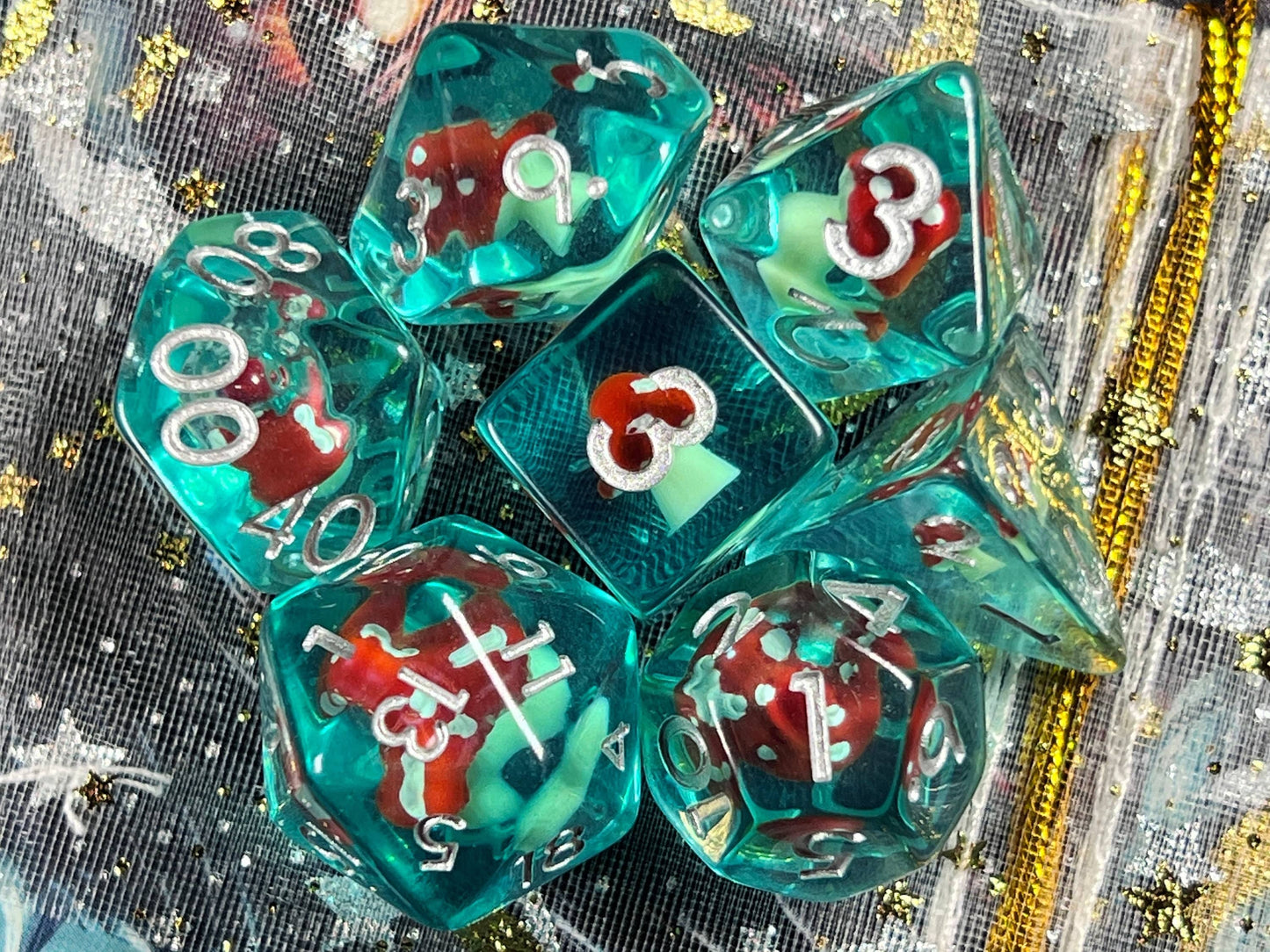 The Crooked Tavern Dice Sets Toadstool RPG Dice Set | Blue Resin with a toadstool inside!