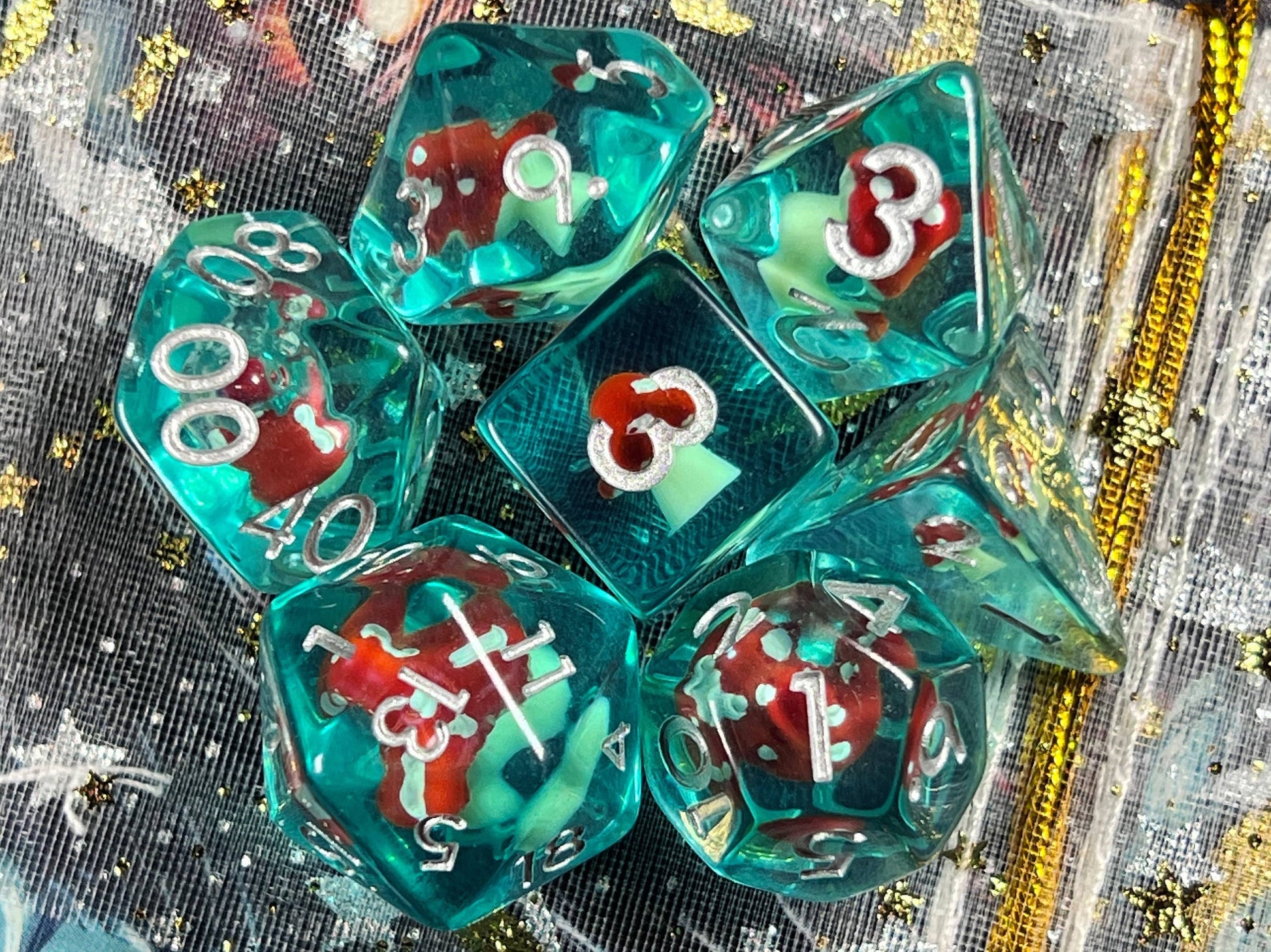The Crooked Tavern Dice Sets Toadstool RPG Dice Set | Blue Resin with a toadstool inside!