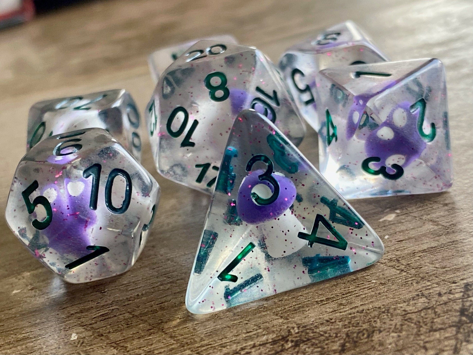 The Crooked Tavern Spore Shroom DnD Dice Set for Dungeons and Dragons | D20 TTRPG Polyhedral Dice Set | A purple shroom and sparkles in every dice!